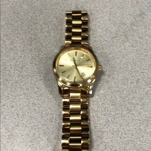 Gold women’s Michael Kors watch